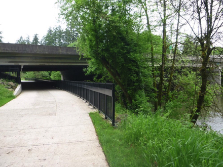 Hard surface trail under Interstate 5 freeway - Tualatin River - iron fence  - security camera - lighting